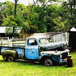 Abandoned car on field