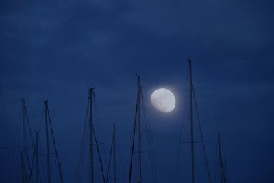 Low angle view of moon against sky at night