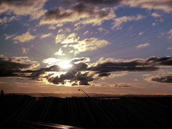 Scenic view of landscape against cloudy sky