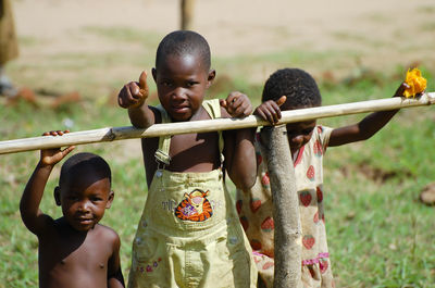 Portrait of children playing outdoors