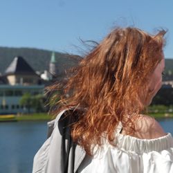 Rear view of woman against sky