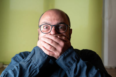 Portrait of man wearing eyeglasses