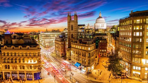 High angle view of city street and buildings against sky