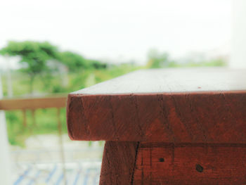 Close-up of railing on table against sky