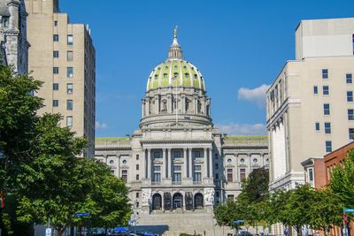 View of buildings against blue sky