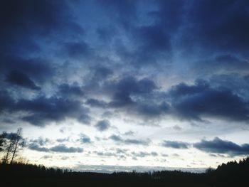 Scenic view of landscape against cloudy sky