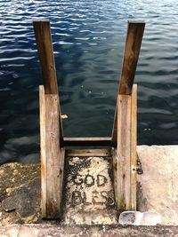 High angle view of wooden post in lake