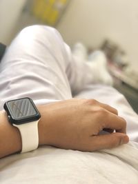 Close-up of woman lying on bed