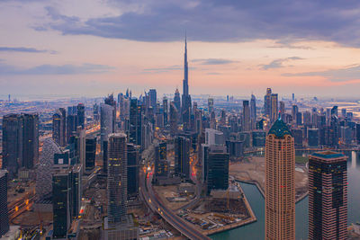 Aerial view of city buildings during sunset