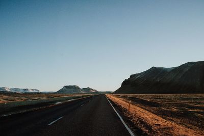 Road amidst landscape against clear sky