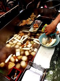 Close-up of man preparing food