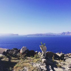 Scenic view of sea against clear blue sky