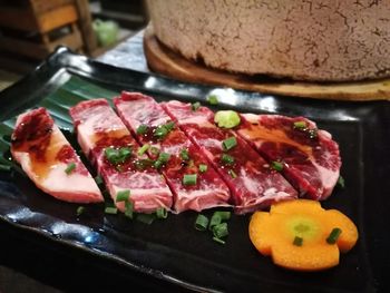 High angle view of meat in plate on table