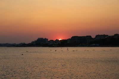 Scenic view of beach against sky during sunset