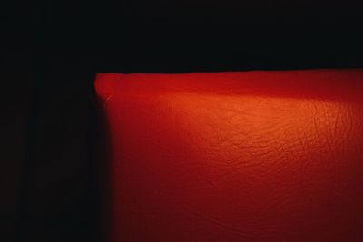 Close-up of red over black background