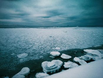 Close-up of frozen sea against sky