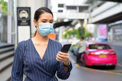 Young woman using mobile phone