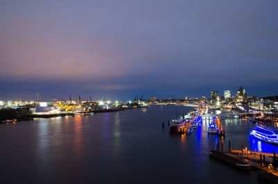 Boats moored at harbor