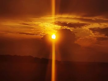 Scenic view of dramatic sky during sunset