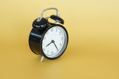 Close-up of clock on wall
