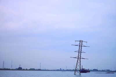 Sailboats sailing in sea against sky