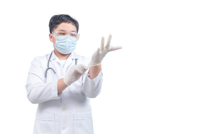 Full length of man standing against white background