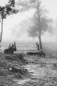 Hand water pump in a foggy field