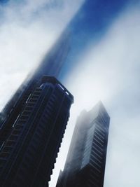 Low angle view of modern buildings against sky