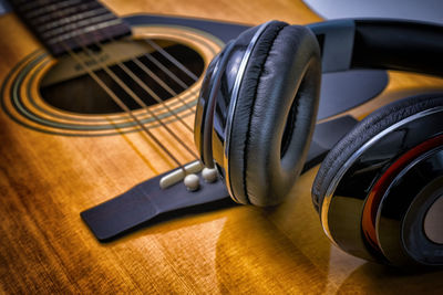 Close-up of headphones on guitar