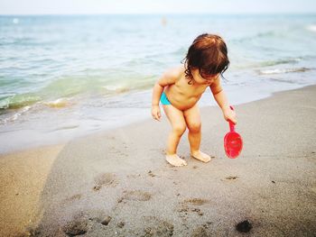 Boy playing on beach