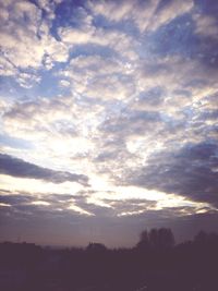 Scenic view of landscape against cloudy sky