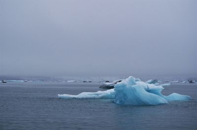 Scenic view of frozen sea against sky