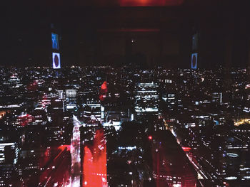 Aerial view of illuminated city at night