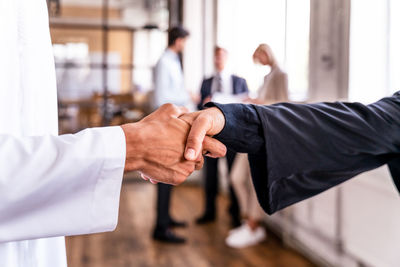 Close-up of business people shaking hands