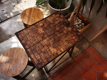 High angle view of empty table and seats at outdoor cafe