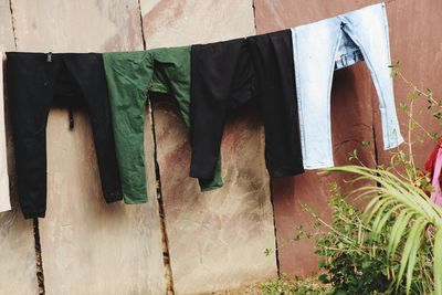 Low section of clothes drying on wood