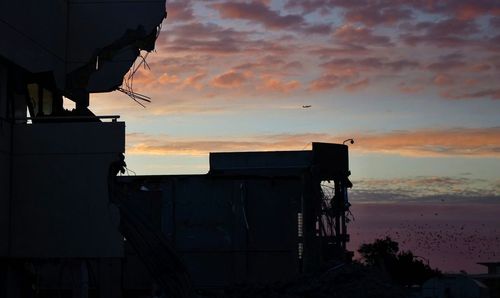 Built structure against sunset sky