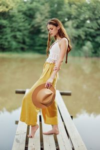 Portrait of young woman using mobile phone