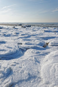 Scenic view of sea against sky during winter