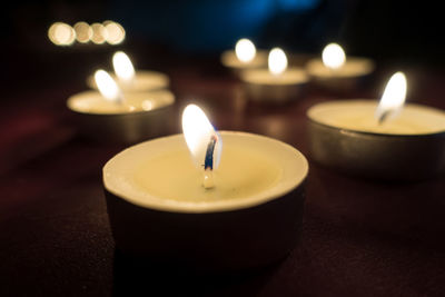 Close-up of tea light candles on table