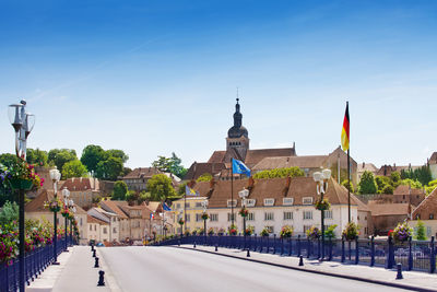 Buildings in city against clear sky