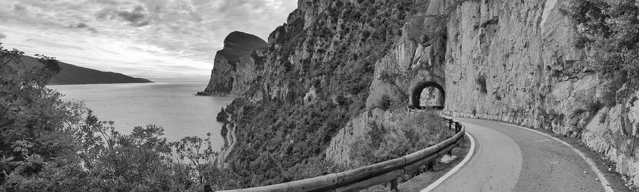 Panoramic view of road by sea against sky