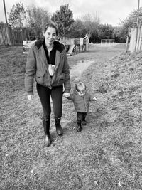 Full length portrait of boy on field