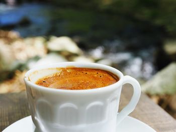 Close-up of coffee cup on table