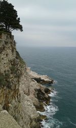 Scenic view of sea against cloudy sky