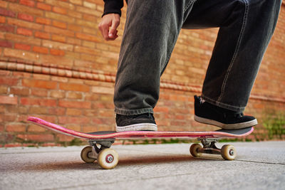 Skateboarder doing trick at urban street