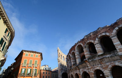 Low angle view of historical building against blue sky