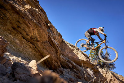 A mountain biker riding downhill in grand junction, colorado.