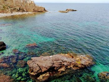 High angle view of rock formation in sea