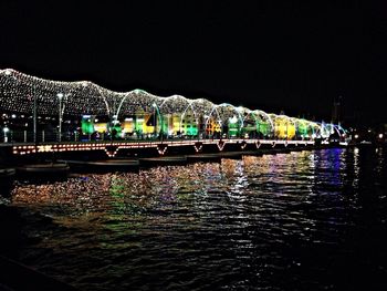 Reflection of illuminated buildings in water